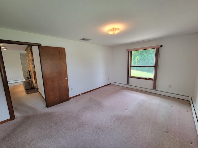 62 Rice Rd, Meriden, CT 06450 - unfurnished bedroom featuring a baseboard heating unit, light carpet, and a baseboard radiator