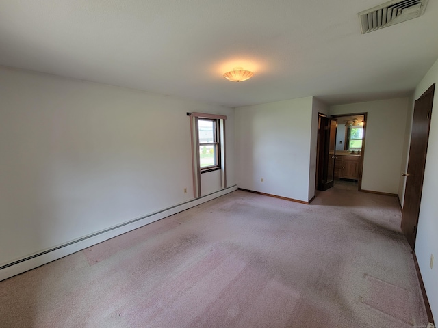 62 Rice Rd, Meriden, CT 06450 - unfurnished room featuring healthy amount of natural light, a baseboard heating unit, and light carpet