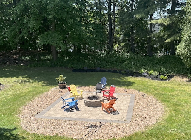 35 Depauw Cir E, Hartford, CT 06108 - view of grassy yard featuring a fire pit and a patio