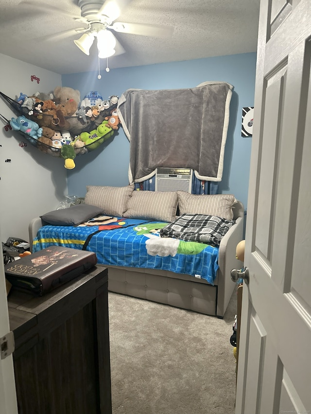 35 Depauw Cir E, Hartford, CT 06108 - bedroom with carpet, a ceiling fan, cooling unit, and a textured ceiling