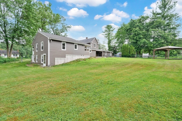 11 Harrington Rd, East Windsor, CT 06016 - view of grassy yard featuring a gazebo and a carport