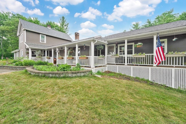 11 Harrington Rd, East Windsor, CT 06016 - rear view of house with covered porch, a yard, and a chimney