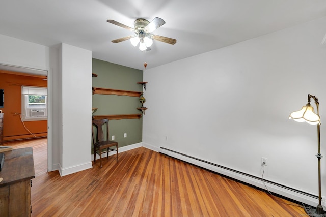 11 Harrington Rd, East Windsor, CT 06016 - empty room featuring baseboard heating, a ceiling fan, wood finished floors, cooling unit, and a baseboard heating unit
