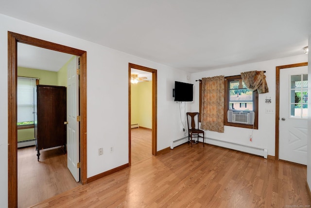 11 Harrington Rd, East Windsor, CT 06016 - entrance foyer featuring baseboard heating, cooling unit, and light wood finished floors
