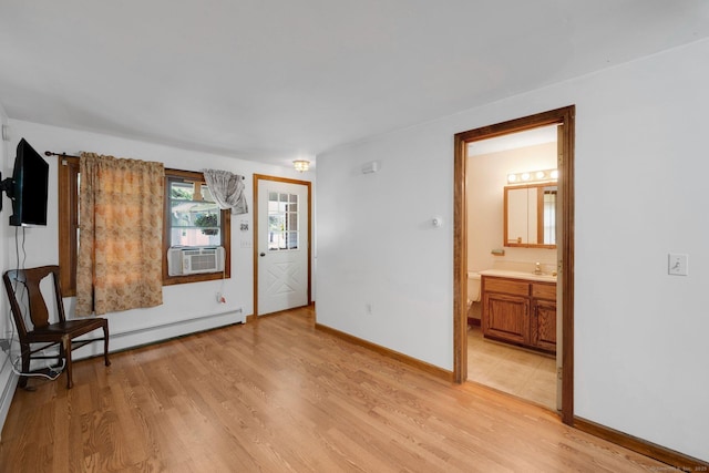 11 Harrington Rd, East Windsor, CT 06016 - unfurnished room with light wood-style flooring, cooling unit, and baseboard heating