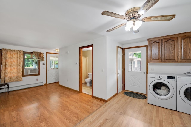 11 Harrington Rd, East Windsor, CT 06016 - washroom with cabinet space, washing machine and clothes dryer, a baseboard radiator, light wood finished floors, and plenty of natural light