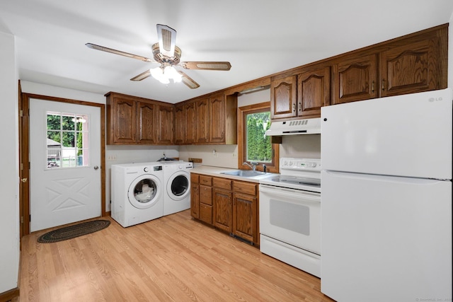 11 Harrington Rd, East Windsor, CT 06016 - kitchen featuring white appliances, independent washer and dryer, under cabinet range hood, light wood-style floors, and light countertops