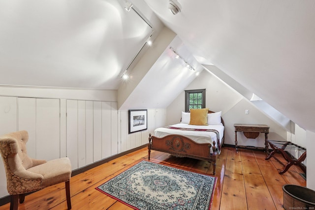 12 Jackson Rd, Killingworth, CT 06419 - bedroom with track lighting, hardwood / wood-style flooring, and vaulted ceiling