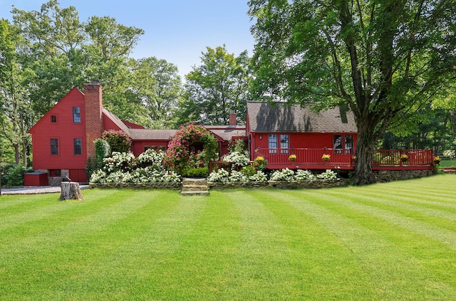 12 Jackson Rd, Killingworth, CT 06419 - rear view of house featuring a chimney, a yard, and a wooden deck