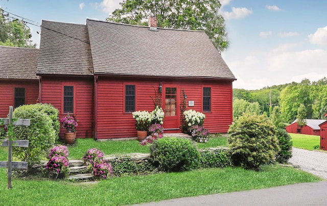 12 Jackson Rd, Killingworth, CT 06419 - view of front of house featuring a chimney, a front lawn, and roof with shingles