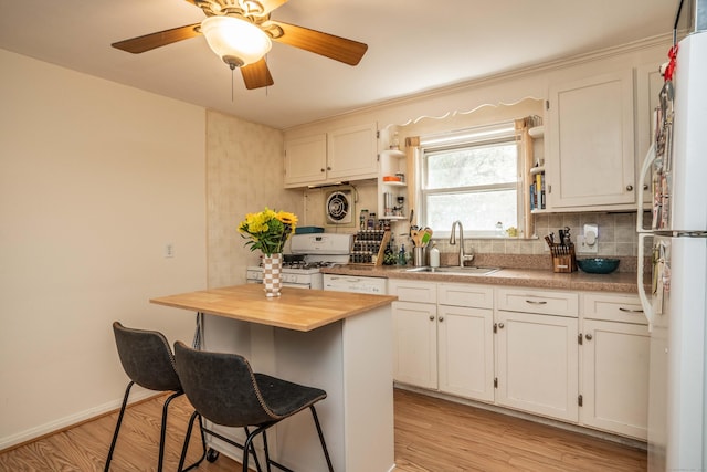 145 Quaker Ln S, West Hartford, CT 06119 - kitchen featuring wooden counters, white appliances, backsplash, a breakfast bar area, and open shelves