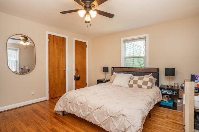 145 Quaker Ln S, West Hartford, CT 06119 - bedroom featuring wood finished floors, multiple closets, and ceiling fan