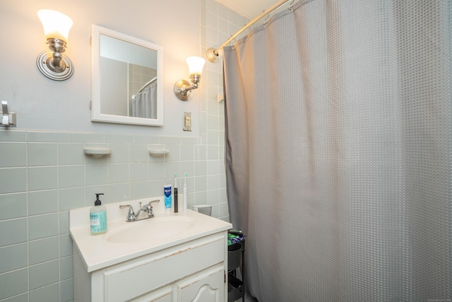 145 Quaker Ln S, West Hartford, CT 06119 - bathroom with tile walls, vanity, and curtained shower