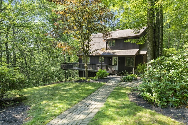 30 W Woods Rd, Burlington, CT 06013 - back of property with a yard, a deck, a shingled roof, and a chimney