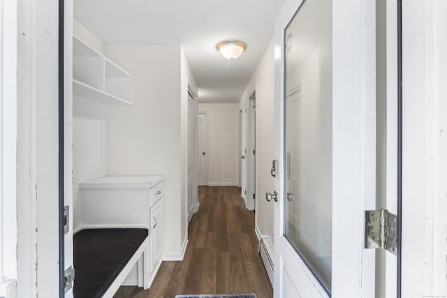 30 W Woods Rd, Burlington, CT 06013 - corridor featuring dark wood-style floors and a baseboard heating unit