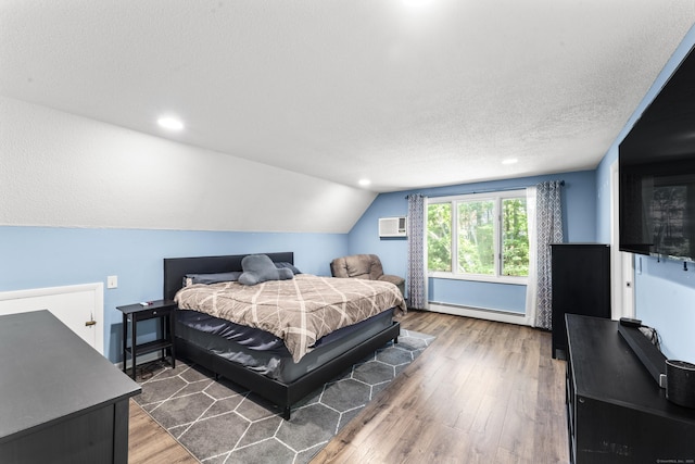 30 W Woods Rd, Burlington, CT 06013 - bedroom with baseboard heating, a wall mounted AC, lofted ceiling, wood finished floors, and recessed lighting