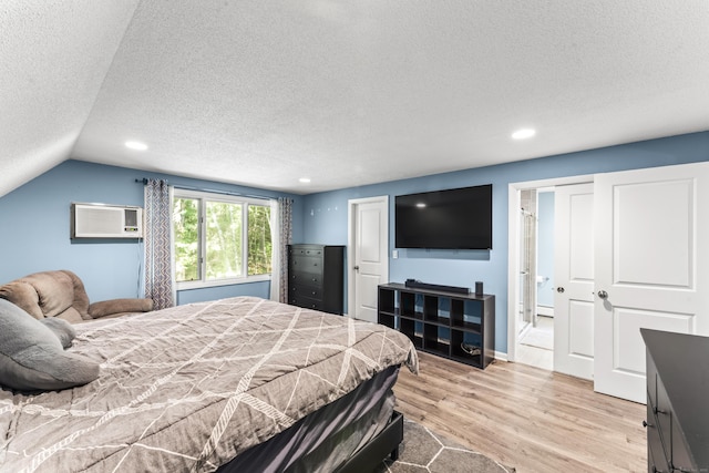 30 W Woods Rd, Burlington, CT 06013 - bedroom with a textured ceiling, light wood finished floors, a wall mounted air conditioner, recessed lighting, and vaulted ceiling