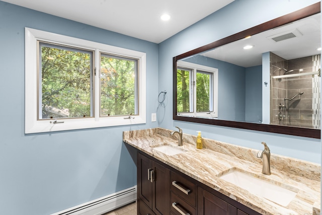 30 W Woods Rd, Burlington, CT 06013 - full bathroom featuring baseboard heating, double vanity, a shower stall, and recessed lighting