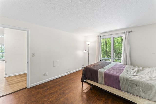 30 W Woods Rd, Burlington, CT 06013 - bedroom with wood finished floors and a textured ceiling