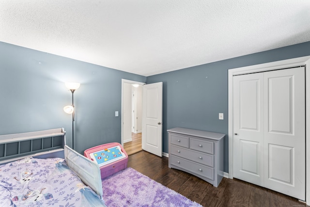 30 W Woods Rd, Burlington, CT 06013 - bedroom with wood finished floors, a closet, and a textured ceiling