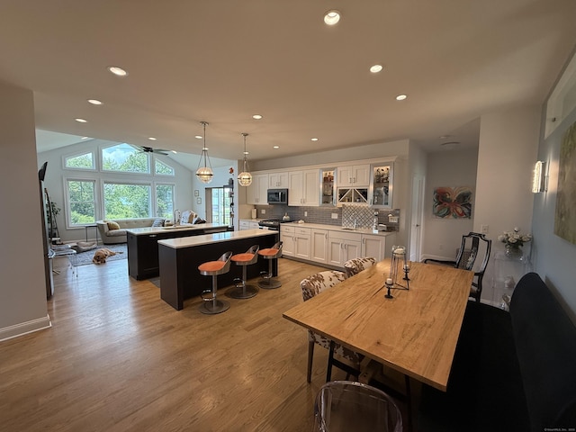 22 Thorson Rd, Oxford, CT 06478 - dining room with light wood-style floors, recessed lighting, and vaulted ceiling