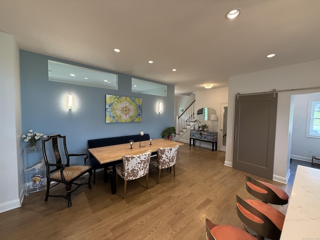 22 Thorson Rd, Oxford, CT 06478 - dining area featuring stairway, a barn door, wood finished floors, and recessed lighting