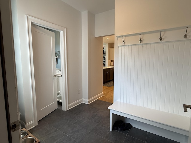 22 Thorson Rd, Oxford, CT 06478 - mudroom featuring dark tile patterned flooring and baseboards