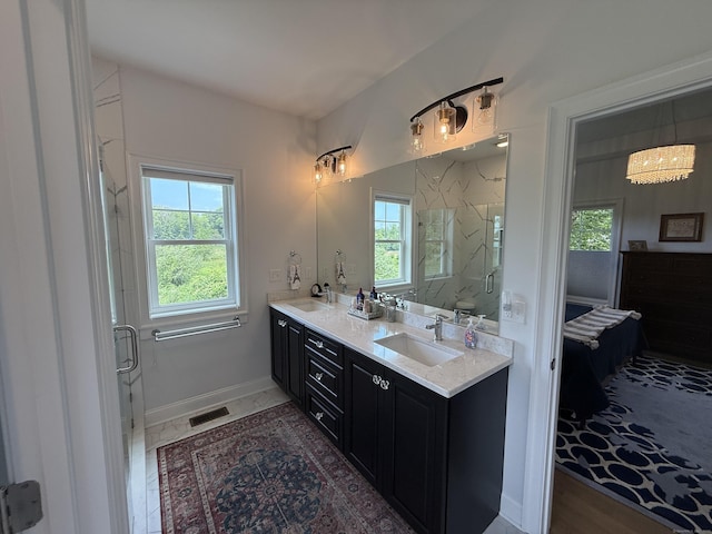 22 Thorson Rd, Oxford, CT 06478 - full bath with double vanity, a marble finish shower, and a chandelier
