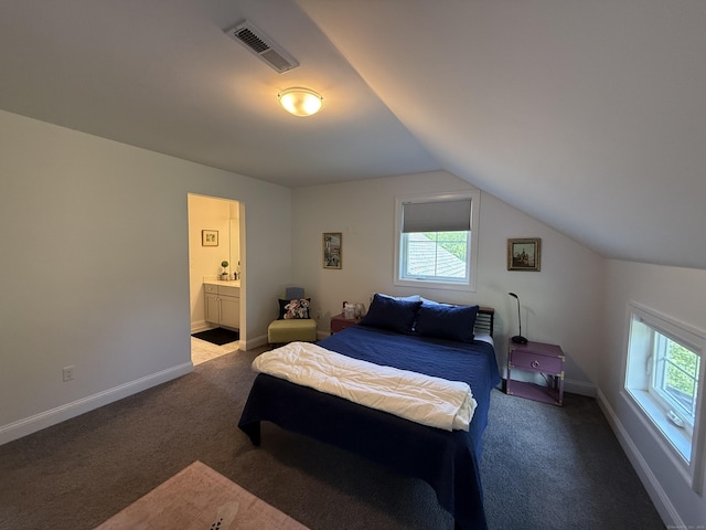 22 Thorson Rd, Oxford, CT 06478 - bedroom with carpet floors, multiple windows, vaulted ceiling, and ensuite bathroom