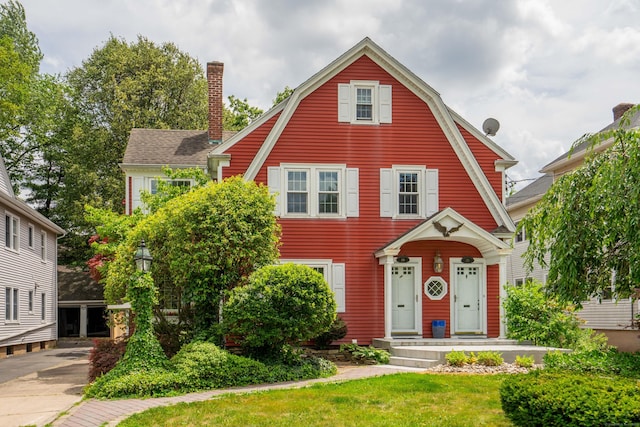 169 Brace Rd, West Hartford, CT 06107 - view of front of home with a gambrel roof and a front lawn