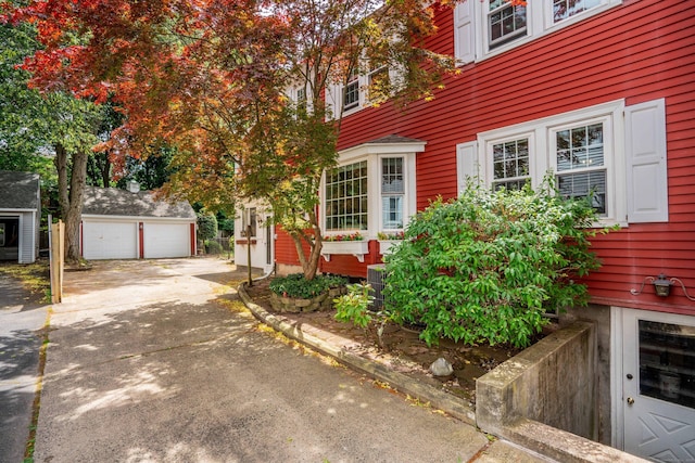 169 Brace Rd, West Hartford, CT 06107 - view of front facade featuring an outdoor structure and a garage