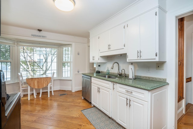 169 Brace Rd, West Hartford, CT 06107 - kitchen featuring dishwasher, light wood-style floors, and white cabinets