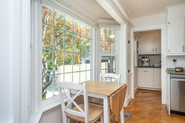 169 Brace Rd, West Hartford, CT 06107 - dining room with light wood-type flooring and ornamental molding