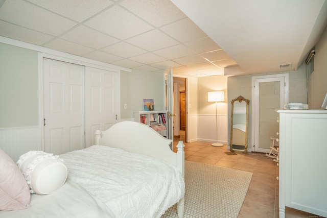 169 Brace Rd, West Hartford, CT 06107 - bedroom with a closet, light tile patterned floors, and a drop ceiling