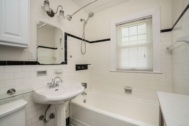 169 Brace Rd, West Hartford, CT 06107 - bathroom with bathing tub / shower combination, tile walls, and decorative backsplash