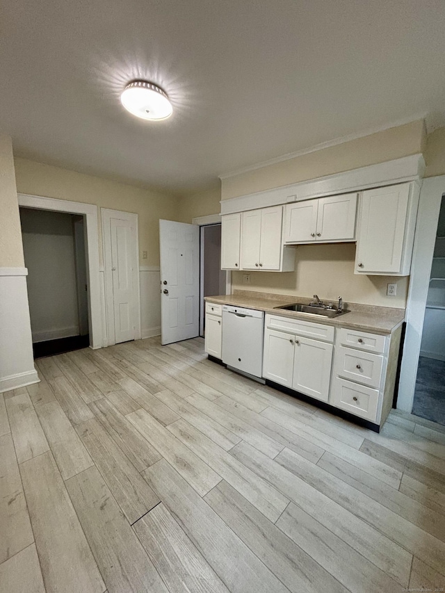 138 Mill Hill Ave, Bridgeport, CT 06610 - kitchen with dishwasher, white cabinetry, light wood finished floors, and light countertops