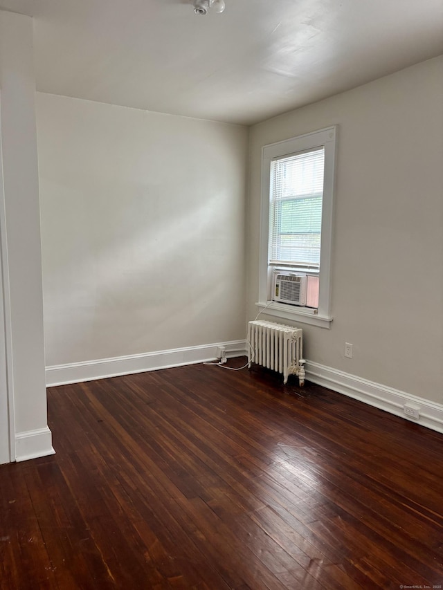 138 Mill Hill Ave, Bridgeport, CT 06610 - spare room with radiator, hardwood / wood-style flooring, and cooling unit