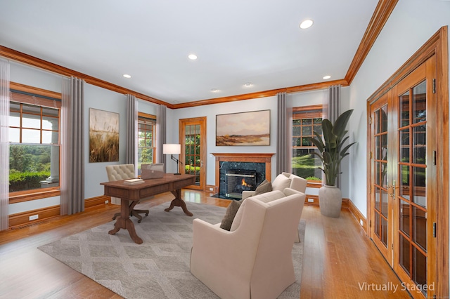 125 Nod Hill Rd, Wilton, CT 06897 - living room featuring ornamental molding, a fireplace, light wood-style flooring, recessed lighting, and french doors