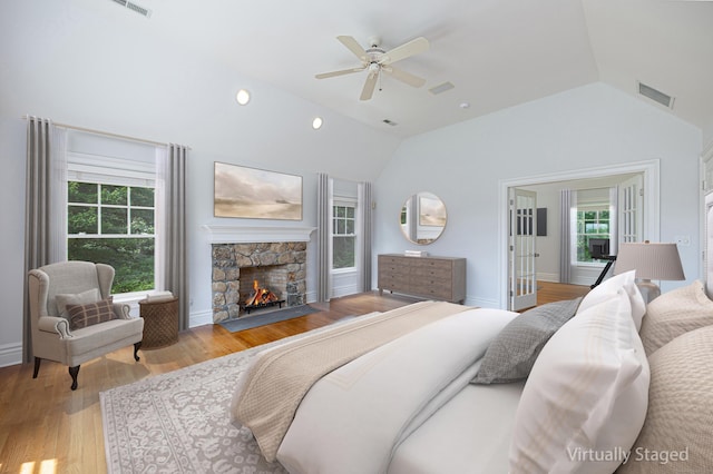 125 Nod Hill Rd, Wilton, CT 06897 - bedroom featuring vaulted ceiling, light wood-style flooring, a fireplace, and a ceiling fan