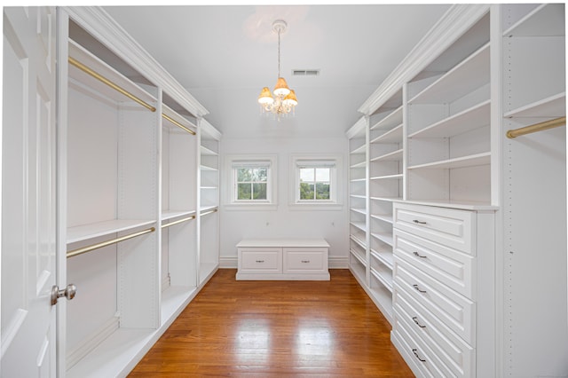 125 Nod Hill Rd, Wilton, CT 06897 - spacious closet featuring wood finished floors and a chandelier