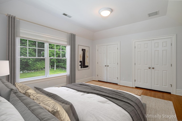 125 Nod Hill Rd, Wilton, CT 06897 - bedroom featuring multiple closets and wood finished floors