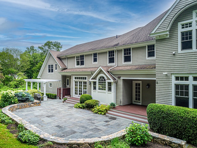 125 Nod Hill Rd, Wilton, CT 06897 - back of property featuring a patio and a shingled roof