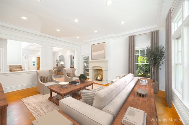 125 Nod Hill Rd, Wilton, CT 06897 - living room with ornamental molding, a warm lit fireplace, recessed lighting, stairway, and decorative columns