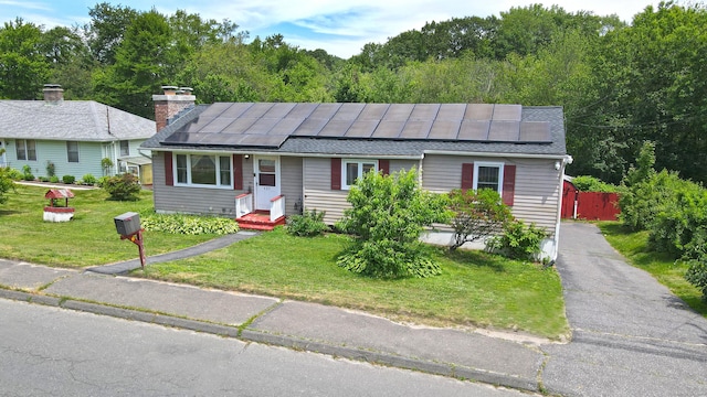 425 Scott Rd, Waterbury, CT 06705 - view of front facade featuring solar panels and roof with shingles