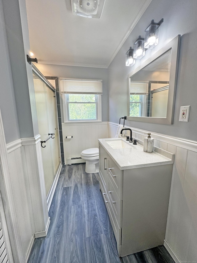 425 Scott Rd, Waterbury, CT 06705 - bathroom with wainscoting, baseboard heating, wood finished floors, a stall shower, and vanity