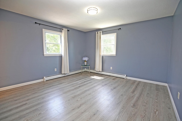 425 Scott Rd, Waterbury, CT 06705 - unfurnished room featuring healthy amount of natural light, wood finished floors, and baseboard heating