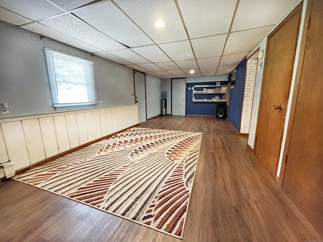 425 Scott Rd, Waterbury, CT 06705 - hall featuring wood finished floors, a drop ceiling, and a wainscoted wall