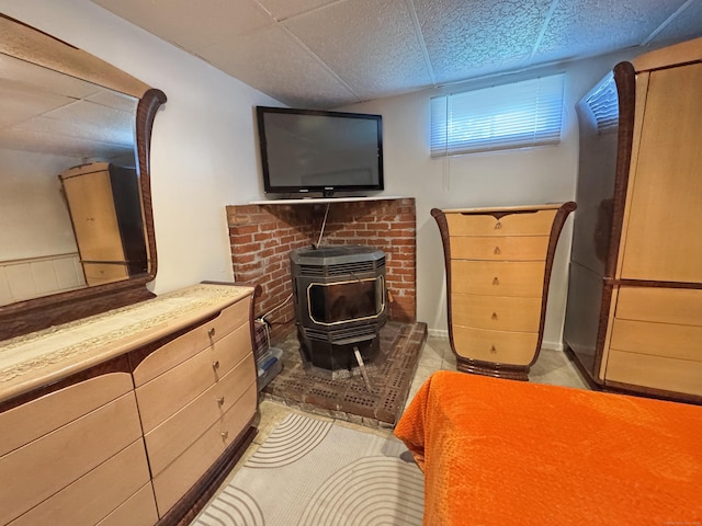 425 Scott Rd, Waterbury, CT 06705 - bedroom with a wood stove and a paneled ceiling