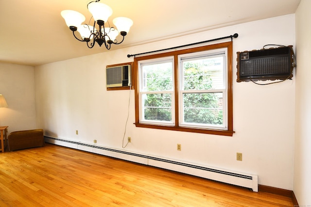 46 Millis St, Hamden, CT 06514 - empty room with a chandelier, a baseboard heating unit, light wood-style floors, and a wall mounted AC