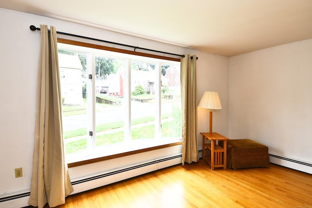 46 Millis St, Hamden, CT 06514 - unfurnished room with light wood-style floors and baseboard heating